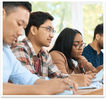 students in class with notebooks